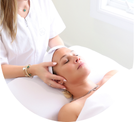 arafed woman getting a facial massage in a salon